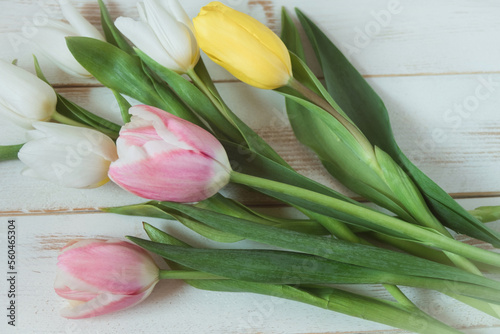 Happy anniversary of love - romantic breakfast in bed with gentle and colorful spring tulip flowers 