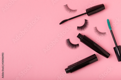 Fototapeta Naklejka Na Ścianę i Meble -  Composition with mascara and false eyelashes on a pink background. Beauty concept. Makeup kit. Makeup. Place for text. Copy space. Close-up. FLETLEY