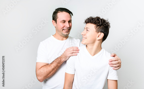 Slika na platnu father with adorable teen son isolated on white