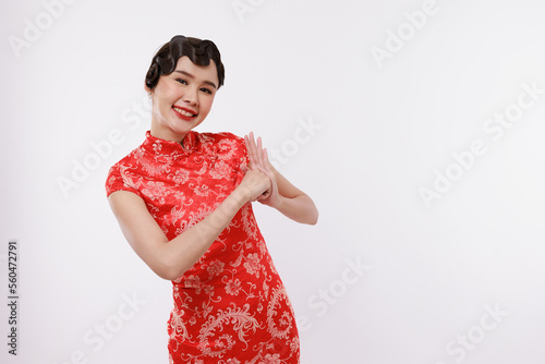 Smiling young beautiful asian woman in traditional dress on isolated white background.