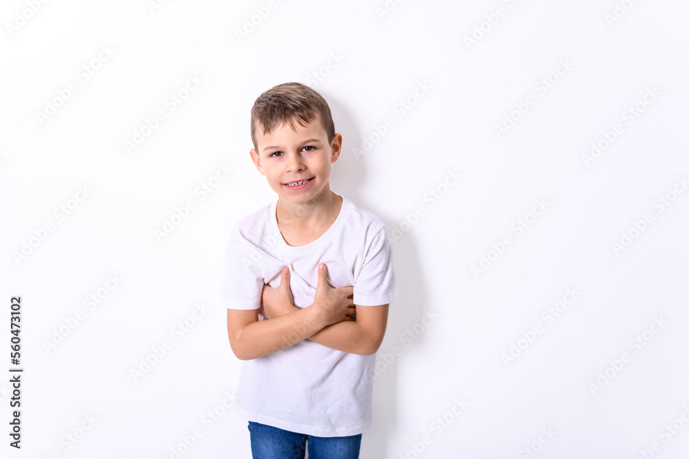 portrait of handsome young boy posing near the white wall portrait of handsome young boy posing near the white wall