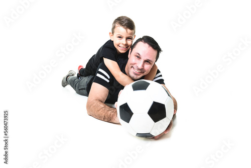 Young man and a boy with a soccer ball isolated on white background