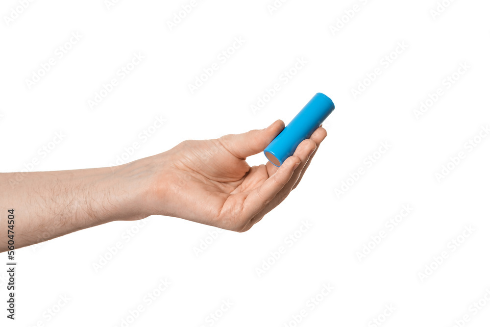 Rechargeable 18650 or 21700 battery in a male hand, isolate. Rechargeable 18650 or 21700 battery in a male hand, isolate.
