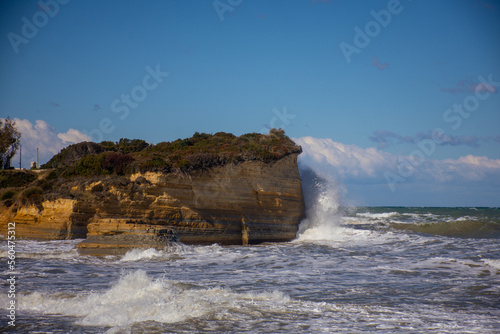 Cloudy and windy weather with large waves at the beach in Peroulades, north Corfu island, Greece