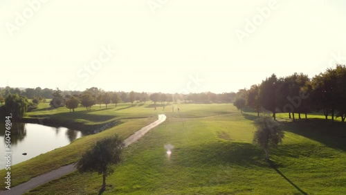 drone view of a golf course at sunset