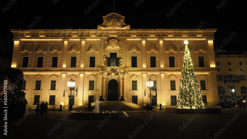 Illuminated classical building with a Christmas tree in Valletta Malta