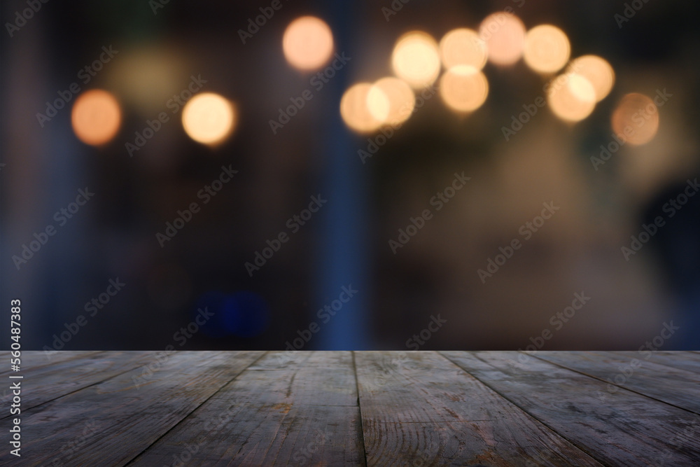 Empty wooden table in front of abstract blurred Cafe, restaurant at night. For montage product display or design key visual layout - Image