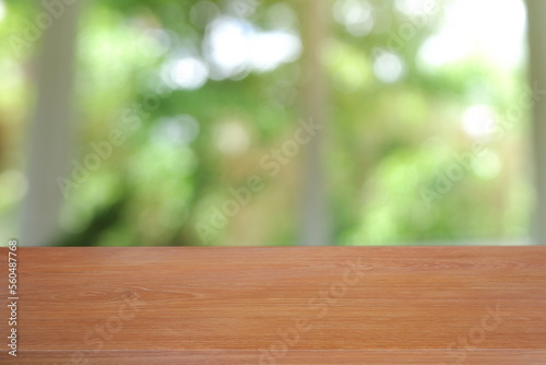 Empty wooden table in front of abstract blurred green of garden and nature light background. For montage product display or design key visual layout - Image 