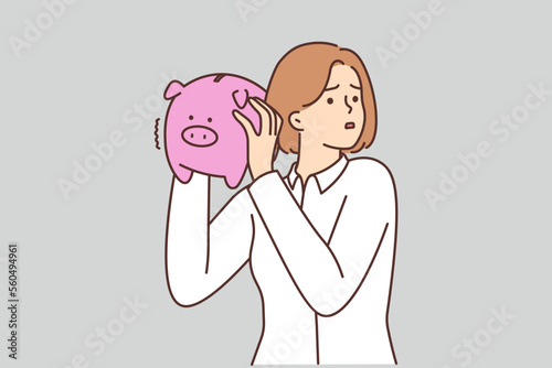 Unhappy woman with piggybank stressed with finances 