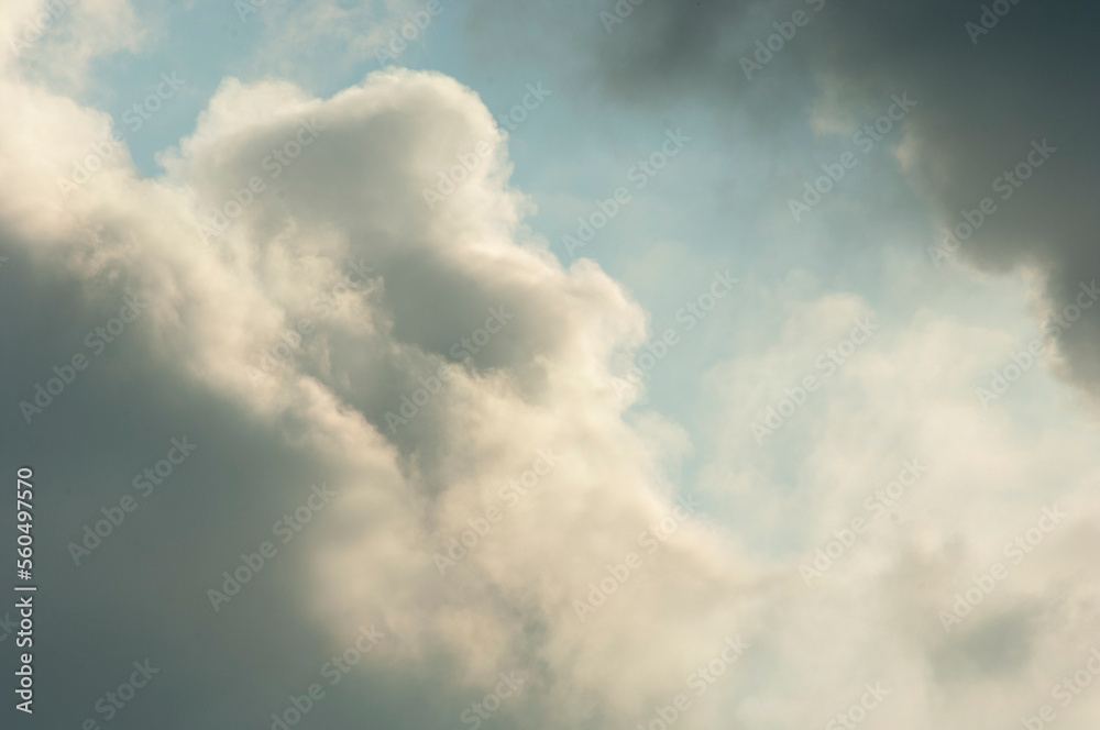 Closeup of building cumulus clouds backlit by sun