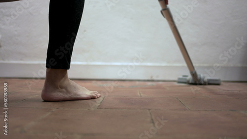 Person cleaning home with vacuum cleaner, woman cleans dirty floor corners3