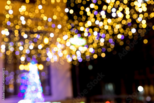 Festive Christmas night city defocused warm yellow bokeh lights abstract background