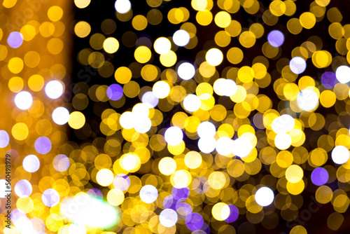 Festive Christmas night city defocused warm yellow bokeh lights abstract background