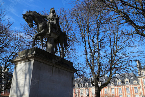 Statue of Louis XIII on a horse - Place des Vosges - Paris - France photo