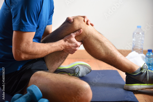 Detail of man doing sports with knee pain