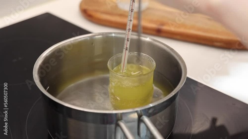 Heat beakers of water and jojoba oil in boiling water, record the temperature with a thermometer