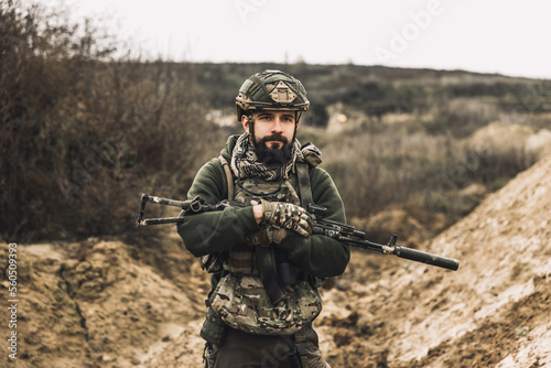 A soldier with a rifle on a shooting range