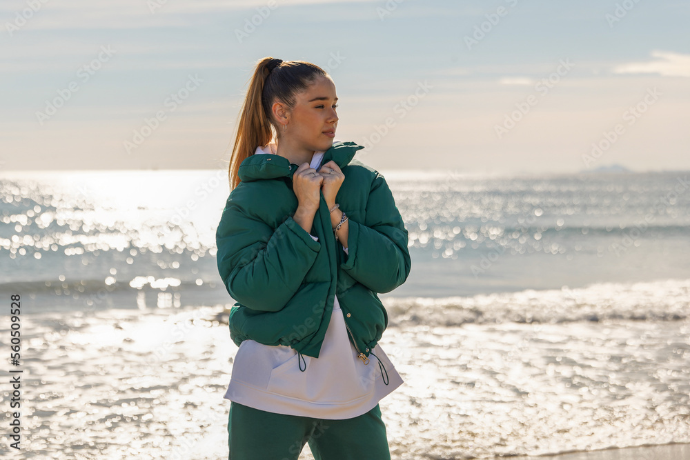 A young athletic girl against the backdrop of the sea A young athletic girl against the backdrop of the sea