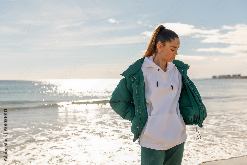A young athletic girl against the backdrop of the sea A young athletic girl against the backdrop of the sea
