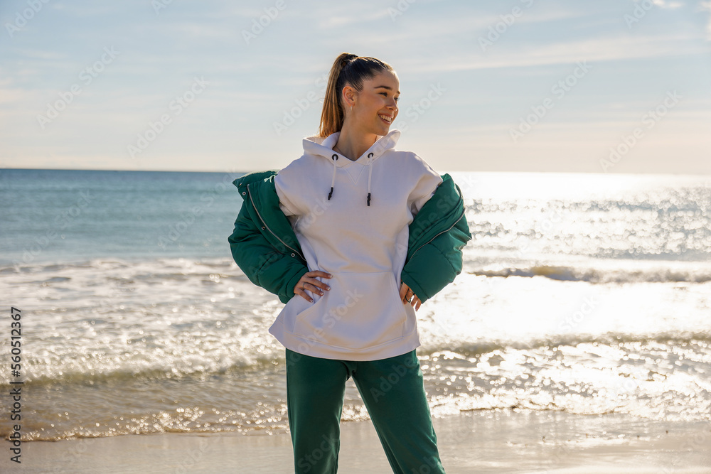 A young athletic girl against the backdrop of the sea A young athletic girl against the backdrop of the sea