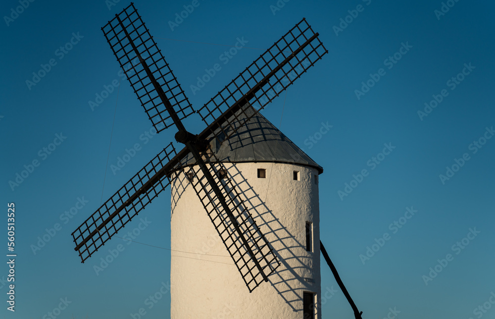Isolated old windmill against blue sky