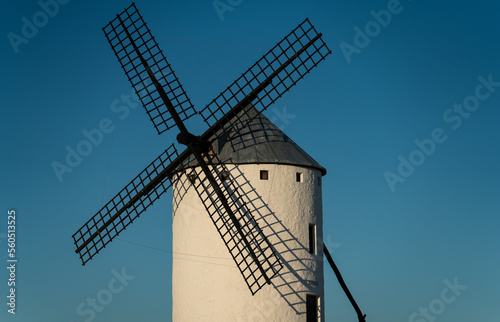 Isolated old windmill against blue sky