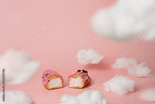 French eclair dessert, styled in white cotton clouds, pink color