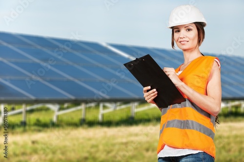 Young engineer worker inspecting a solar panel