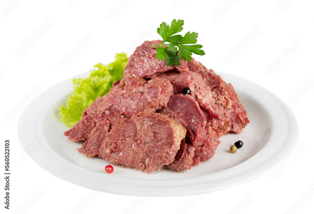 Canned juicy beef served on a plate with greens Canned juicy beef served on a plate with greens