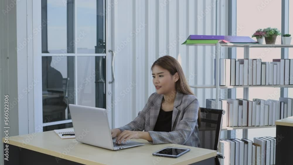 Business concept of 4k Resolution. Asian woman working using laptop in office. Business concept of 4k Resolution. Asian woman working using laptop in office.