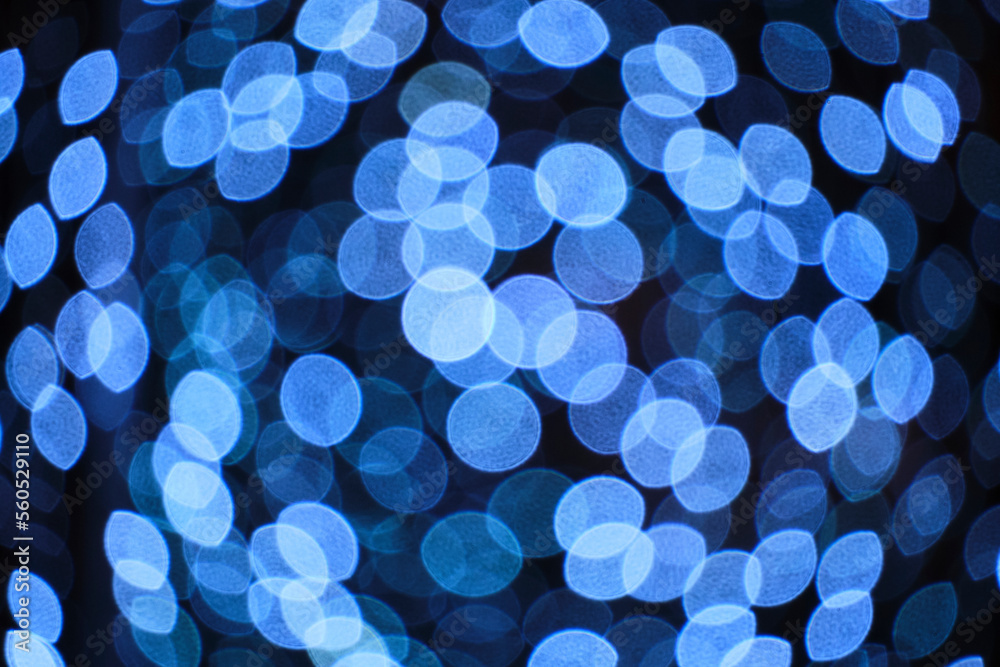 Abstract bright background, bokeh of burning blue light bulbs. Abstract bright background, bokeh of burning blue light bulbs.