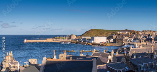 A view across the rooftops of Whitehills towards the harbour photo