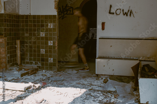 Person walking in an abandoned building 