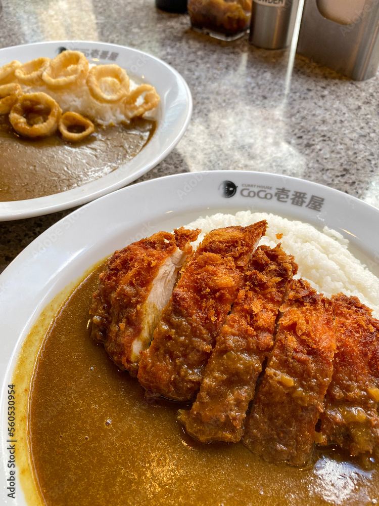 Coco Ichibanya restaurant. Plates of steaming curry with rice. Katsu