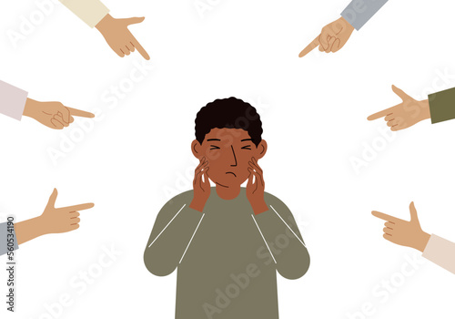 The concept of public condemnation, victim blaming and bullying. Crying depressed boy. The fingers point at the character and hate him. Internet cyberbullying.