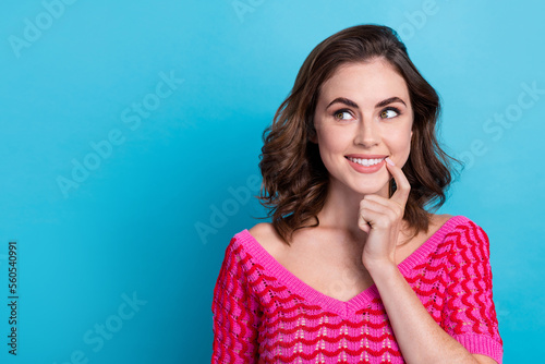 Closeup portrait of attractive nice brown wavy hair lady bite finger look dreamy empty space want buy new car isolated on blue color background