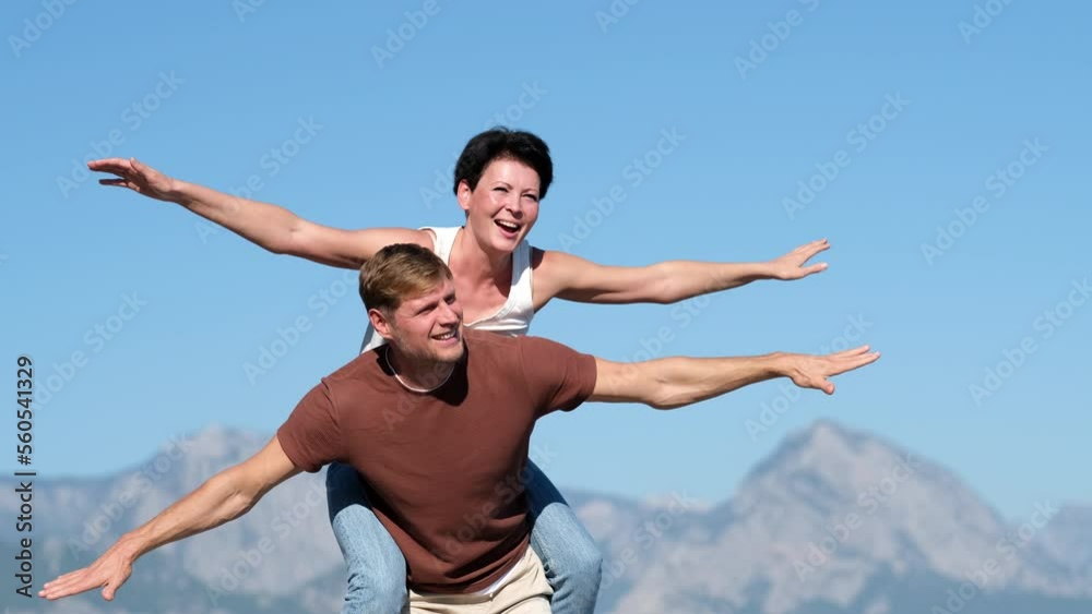 Couple in love opened their arms like the wings of an airplane. Travel concerts. Couple in love opened their arms like the wings of an airplane. Travel concerts.