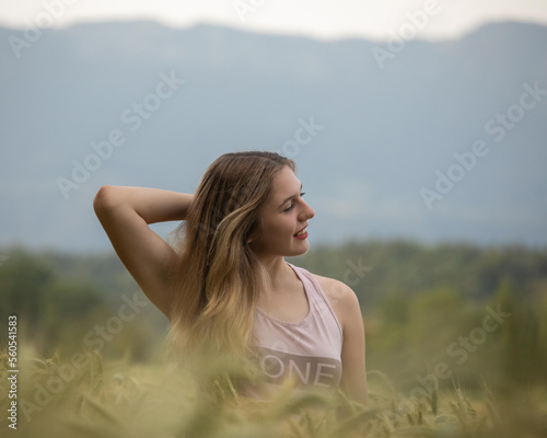 portrait of a woman in a field of wheat