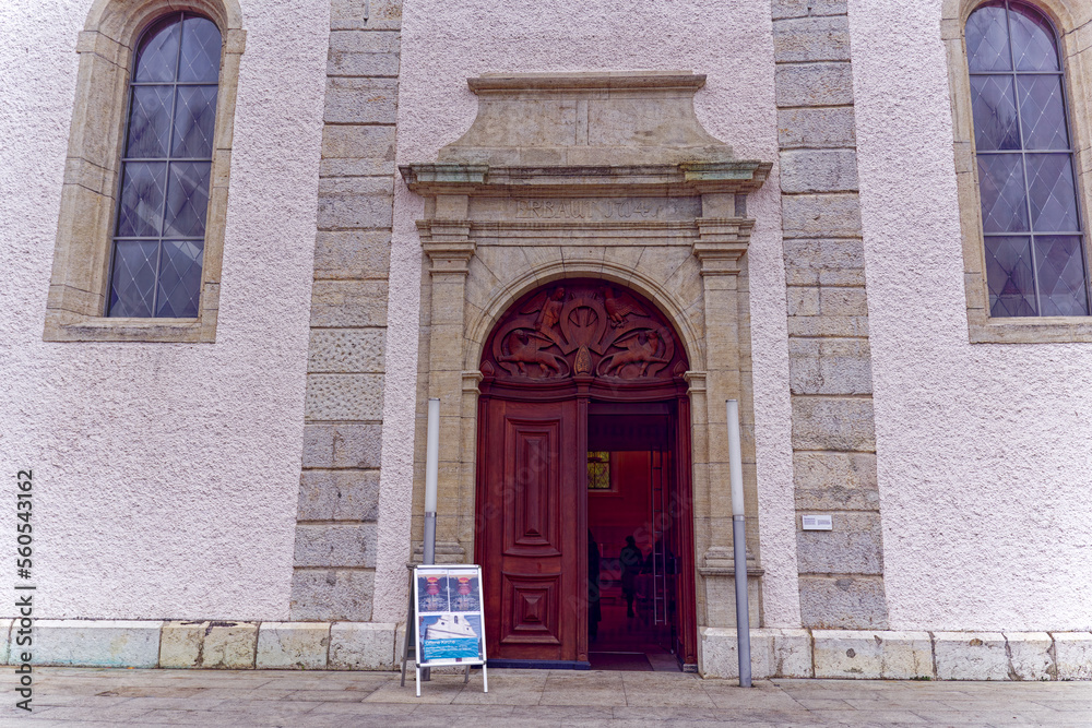Entrance of catholic church with open wooden gate at City of Baden, Canton Aargau, on a cloudy gray autumn day. Photo taken November 13th, 2022, Baden, Switzerland.