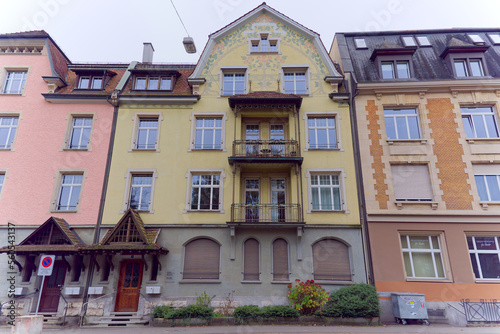 Colorful facades of apartment buildings at Swiss City of Baden, Canton Aargau, on a cloudy autumn day. Photo taken November 13th, 2022, Baden, Switzerland.