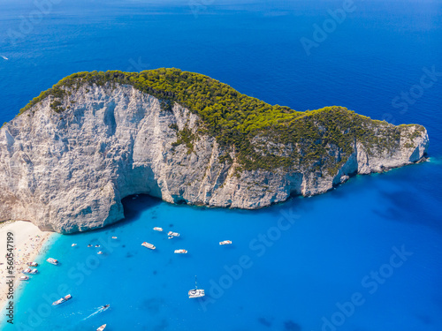 Drone shot of the famous Navagio beach and high limestone walls surrounding the shipwreck at the beautiful turquoise Ionian sea, Zakynthos (Zante) island