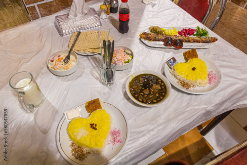 Meals in Iran. Ghormeh Sabzi and Kabab Koobideh, both with saffron rice. photo