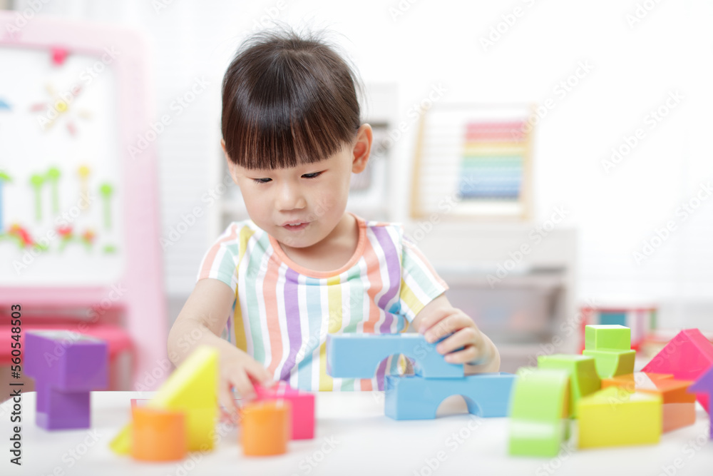 young girl playing creative blocks at home young girl playing creative blocks at home