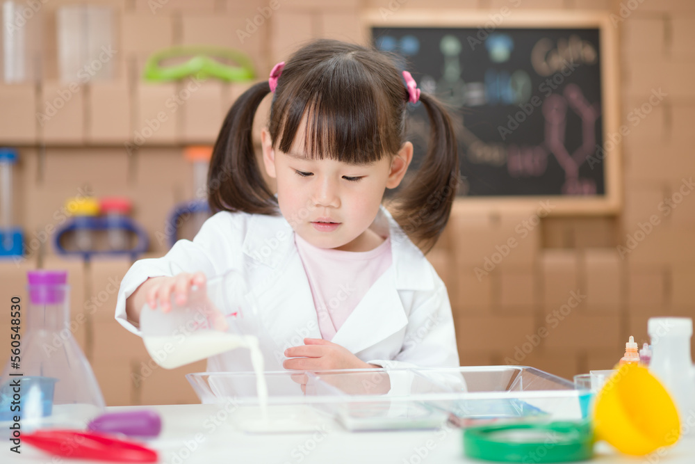 young girl plays science experiment for home schooling young girl plays science experiment for home schooling