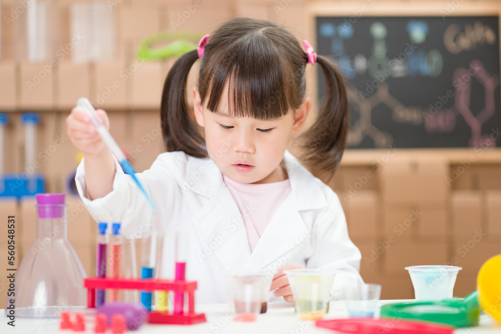 young girl plays  science experiment for home schooling