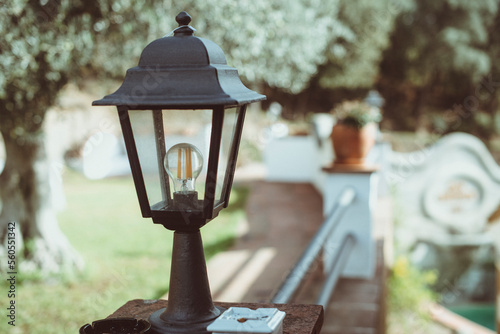 Close-up of an outdoor electric lamp in a park in springtime, Spain photo