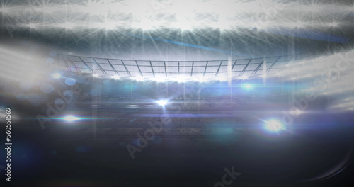 Image of neon soccer ball over sport stadium