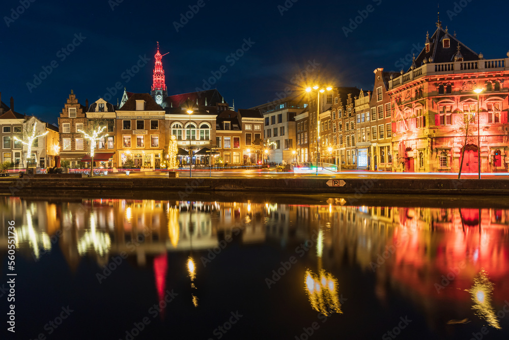 Night view of the Haarlem city, water reflection.