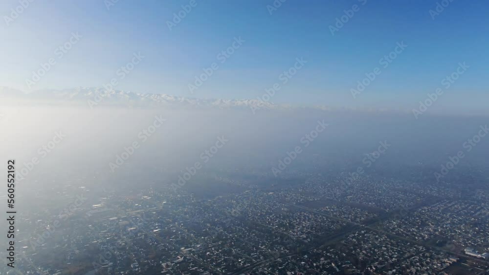 Aerial view of polluted city covered with smog Aerial view of polluted city covered with smog
