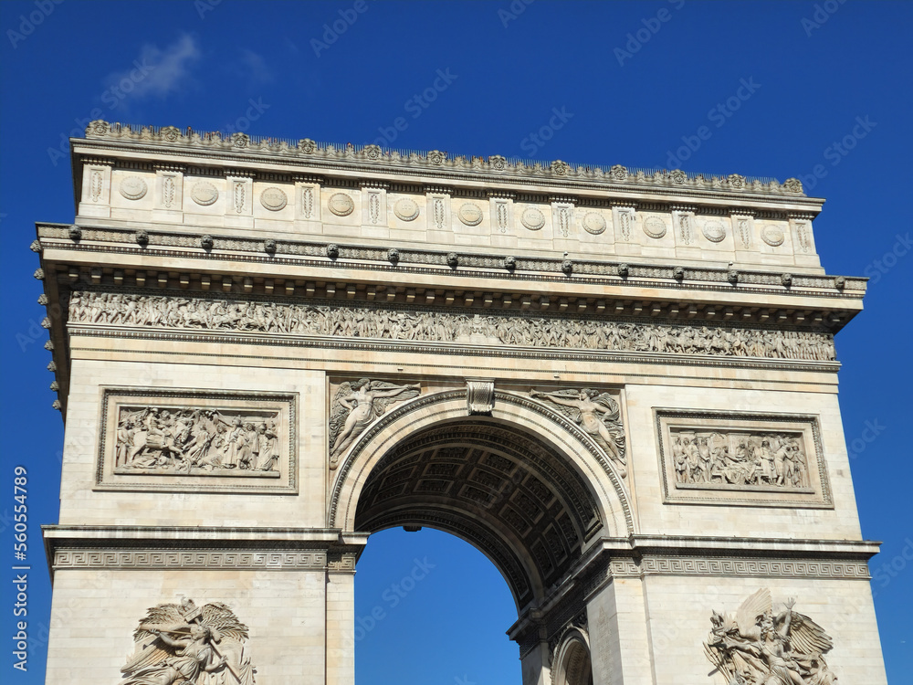 Arc de Triomphe with clear blue sky in low angle